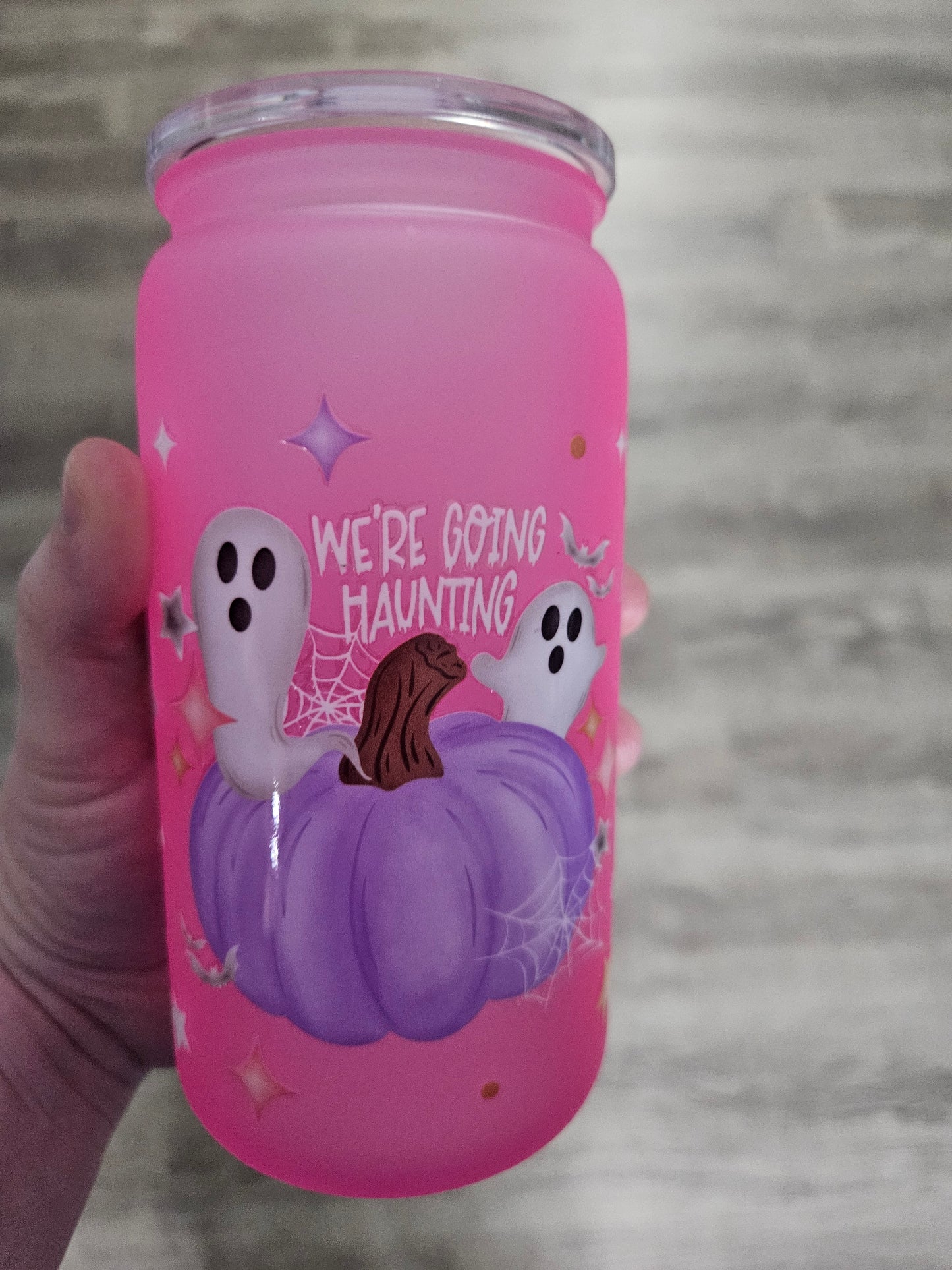 16oz acrylic drinkware that says we're going haunting