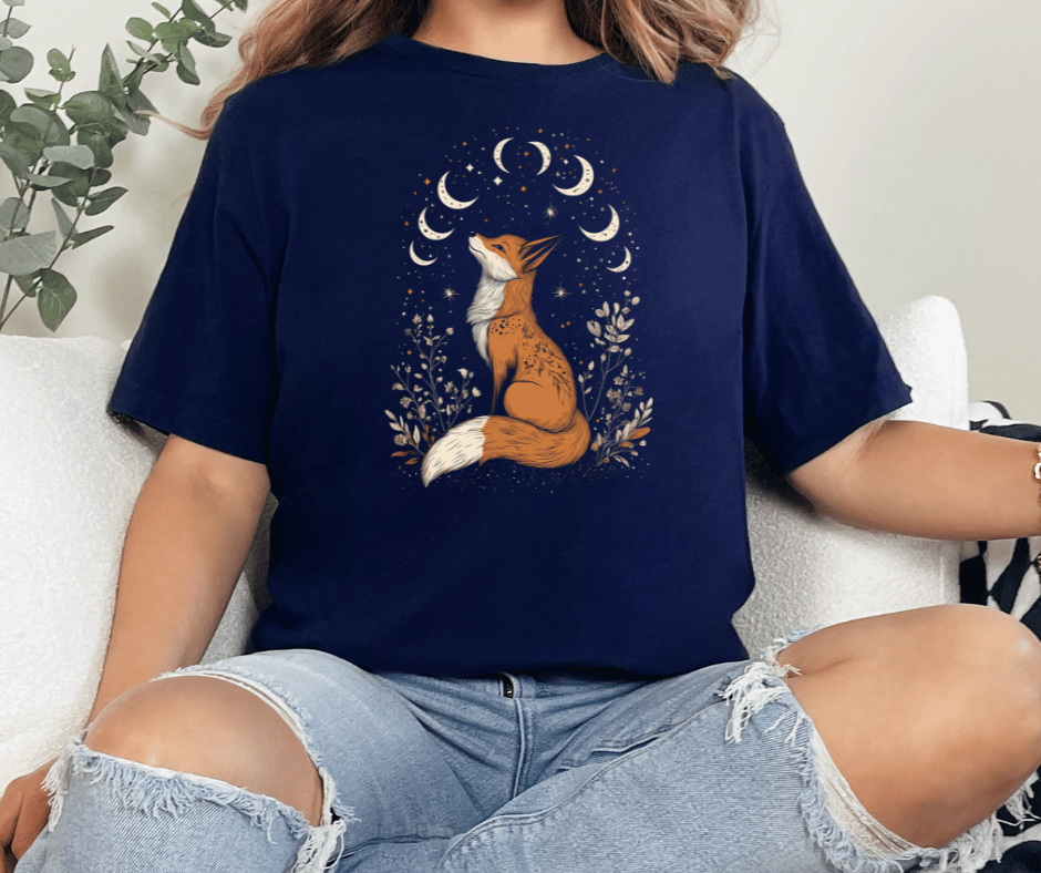Graphic T-Shirt With A Fox Sitting Looking Up At Several Moons