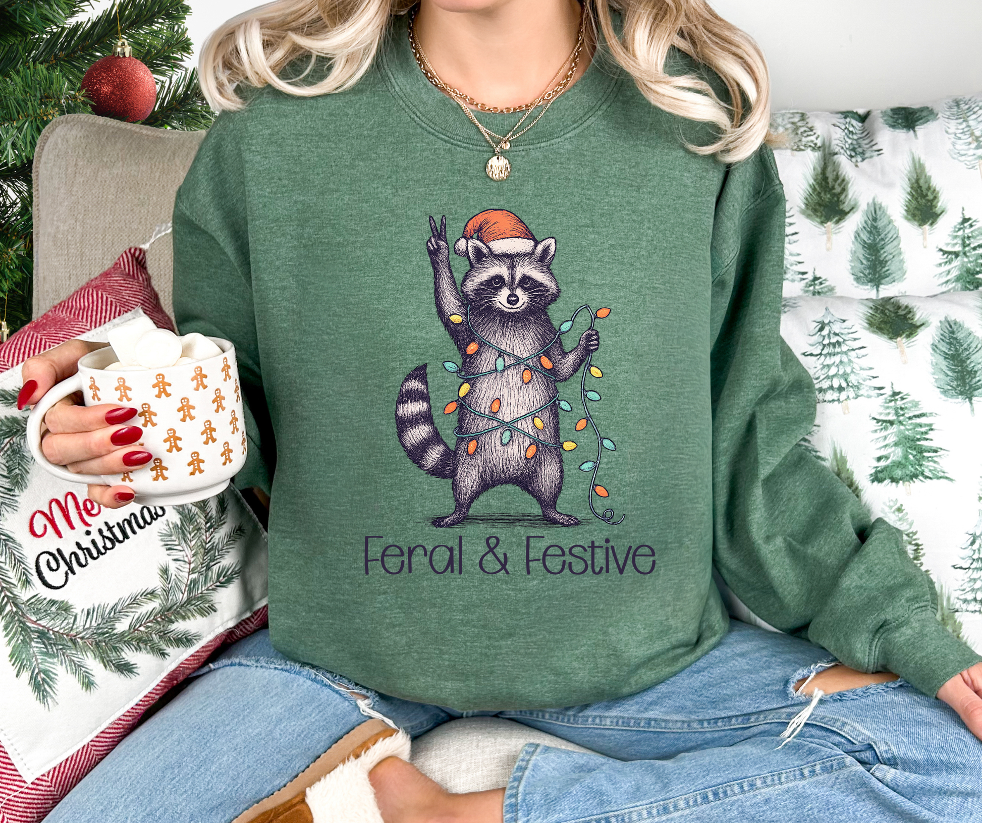 Holiday Sweatshirt With A Festive Raccoon Wrapped in Lights with A Santa Hat And The Text Feral & Festive