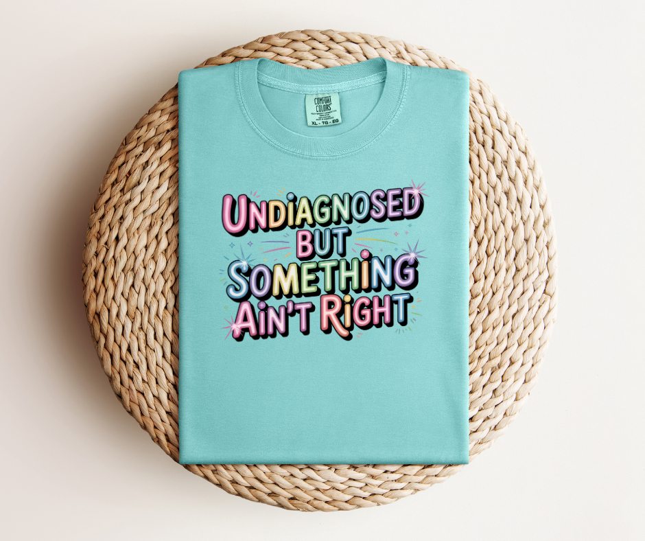 Chalky Mint Crewneck Graphic T-Shirt With The Graphic Text "Undiagnosed But Something Ain't Right"