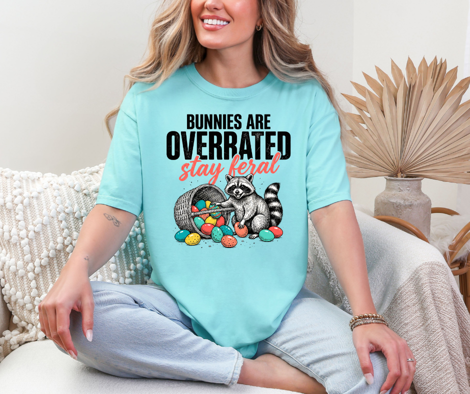 Graphic T-Shirt With A Raccoon & A Basket Of Eggs Showing The Test Bunnies Are Overrated  Stay Feral