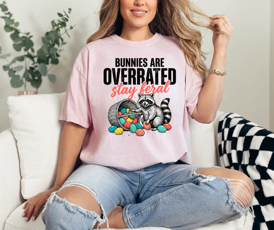 Graphic T-Shirt With A Raccoon & A Basket Of Eggs Showing The Test Bunnies Are Overrated  Stay Feral