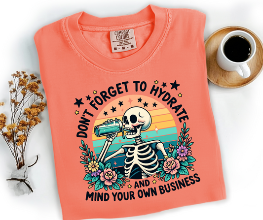 Graphic T-Shirt With Skeleton Drinking And The Text Don't Forget To Hydrate And Mind Your Own Business