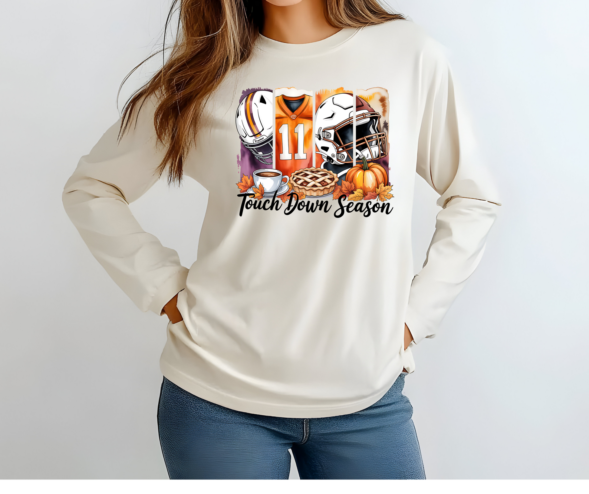 Berry colored long-sleeve  graphic t-shirt with football-themed design featuring a helmet, jersey, and pie with the words Touch Down Season
