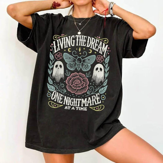 Graphic T-Shirt Apparel With A Ghost Graphic And athe Text Living The Dream One Nightmare At A Time